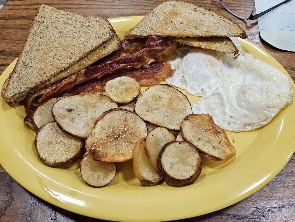 Bacon Eggs Fried Potatoes and Toast
